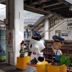 Mascots welcoming visitors at the station.