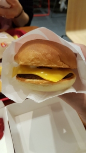 A tiny cheeseburger from Lotteria Fast Food joint. Seoul, Korea.