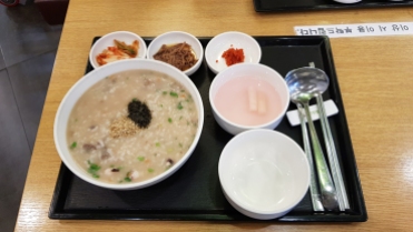 Korean octopus porridge with side dishes in Seoul, Korea.